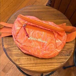 Eddie Bauer Stowaway Swirl Patterned Crossbody Bag in Orange